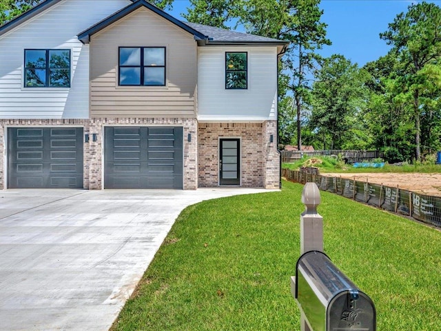 view of front facade featuring a front yard and a garage