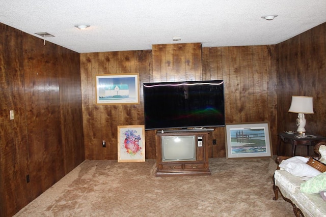 living room featuring light carpet and wooden walls