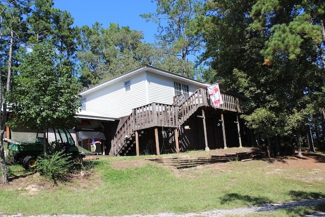 rear view of property with a wooden deck