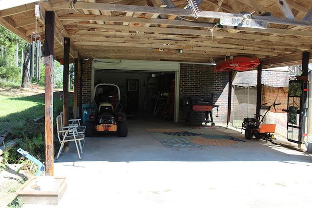 view of patio / terrace featuring a grill and a garage