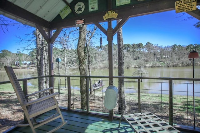 wooden terrace with a water view