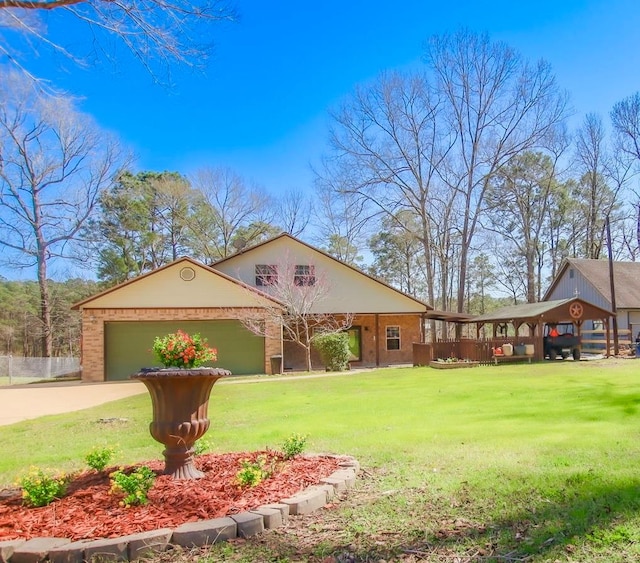 view of front of house with concrete driveway, an attached garage, and a front lawn