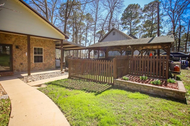 view of yard featuring fence, a patio, and a gazebo