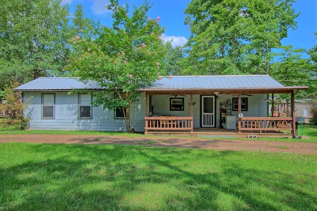 view of front of house with a porch and a front yard