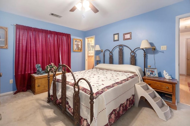bedroom featuring visible vents, a ceiling fan, carpet, and baseboards
