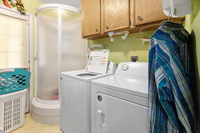 laundry room with cabinet space and washing machine and dryer