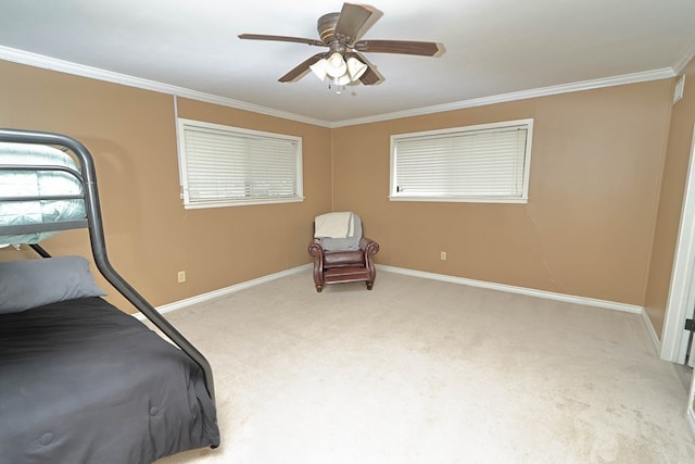 bedroom with ceiling fan, baseboards, ornamental molding, and carpet