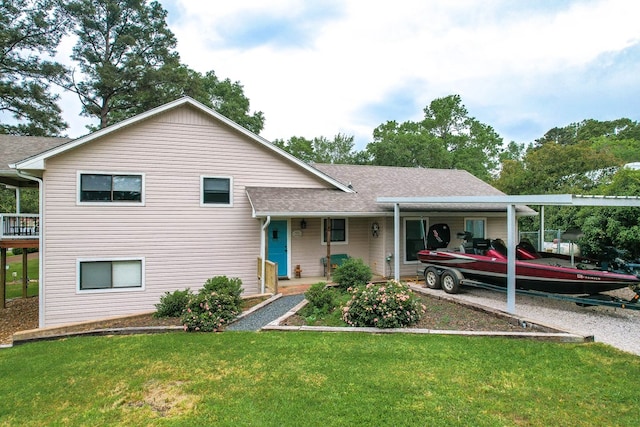 tri-level home featuring a porch, a shingled roof, and a front lawn