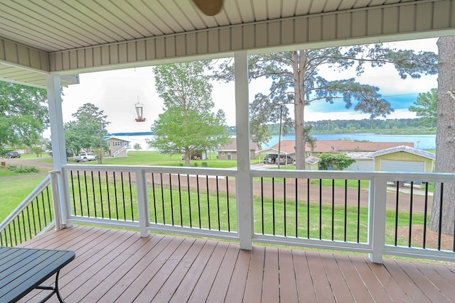 deck featuring a water view and a yard