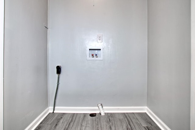 clothes washing area featuring hookup for an electric dryer, hookup for a washing machine, and wood-type flooring