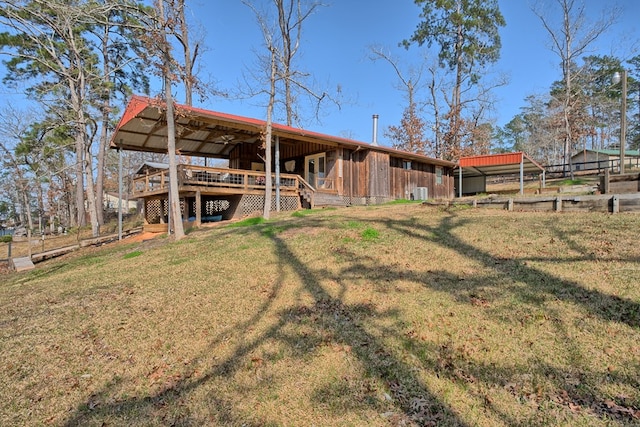 exterior space featuring a lawn and an outdoor structure