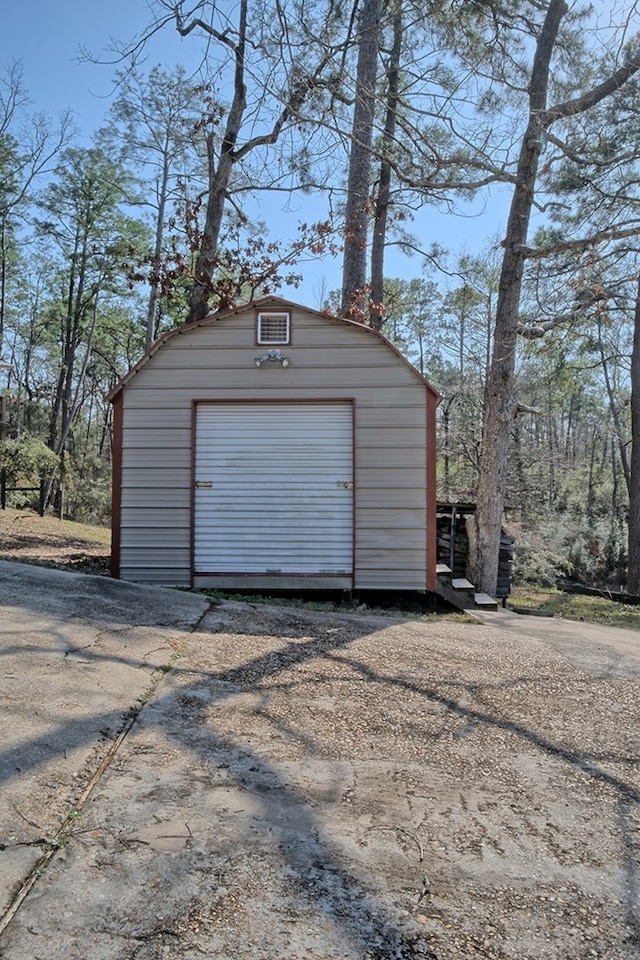 detached garage featuring driveway