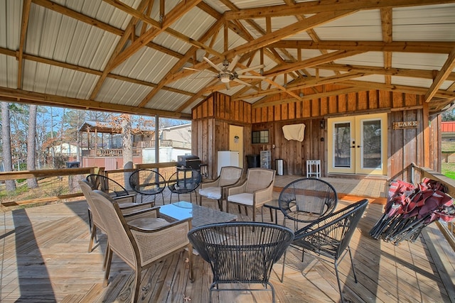 deck with grilling area, french doors, and outdoor dining area