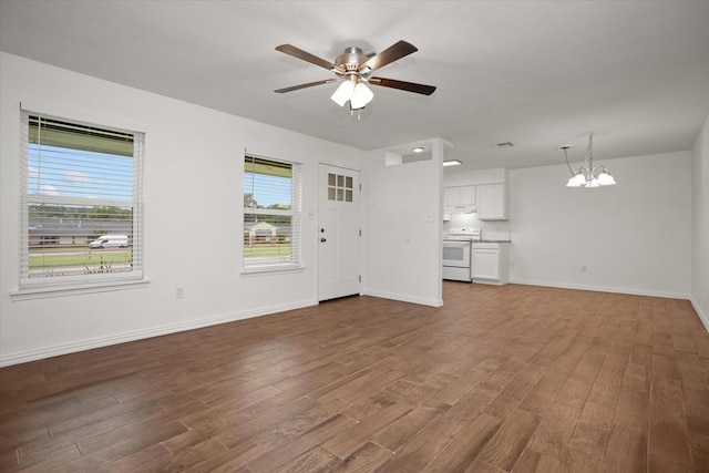 413 Linn St, Huntington, TX 75949 - unfurnished living room featuring a chandelier, dark wood finished floors, a ceiling fan, and baseboards