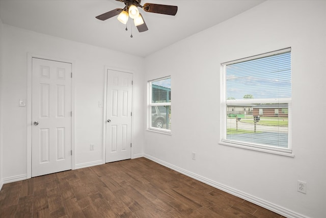 413 Linn St, Huntington, TX 75949 - unfurnished bedroom with wood finished floors, baseboards, and a ceiling fan