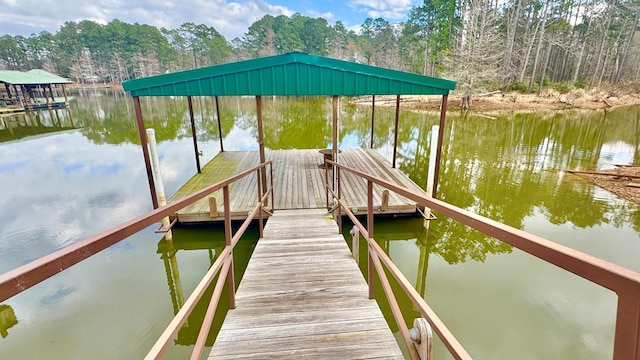 dock area with a water view