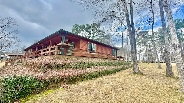 view of side of property with a deck