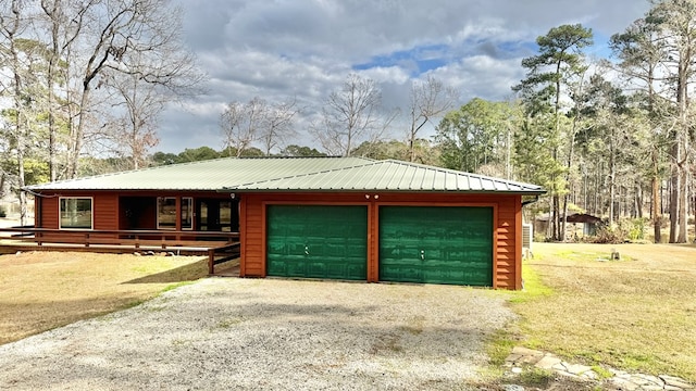 view of front of property featuring an outbuilding and a garage