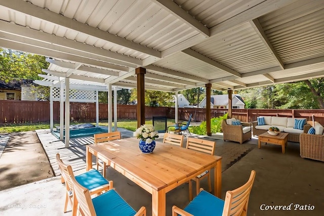 view of patio / terrace with a pergola, an outdoor hangout area, a fenced backyard, and outdoor dining area