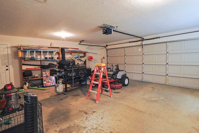 232 Cove Ln, Brookeland, TX 75931 - garage with a garage door opener