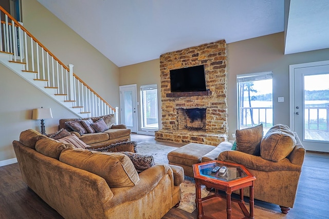232 Cove Ln, Brookeland, TX 75931 - living area featuring stairway, wood finished floors, a fireplace, and baseboards