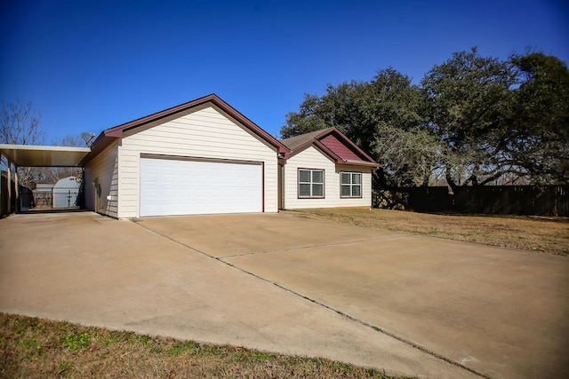 view of front of home featuring a garage and a carport