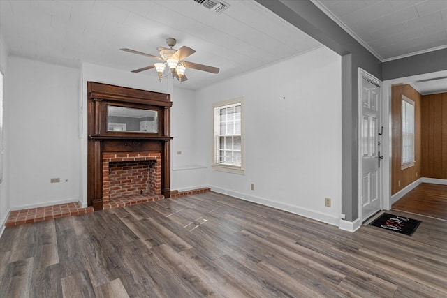 unfurnished living room with a fireplace, crown molding, dark hardwood / wood-style flooring, and ceiling fan