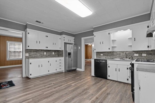 kitchen featuring white cabinetry, stainless steel fridge, stove, and black dishwasher