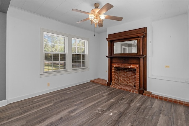 unfurnished living room featuring crown molding, dark hardwood / wood-style flooring, and ceiling fan