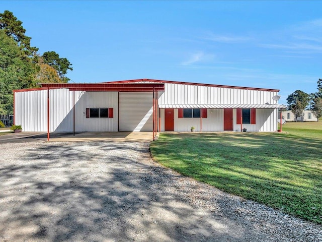 view of outbuilding featuring a lawn