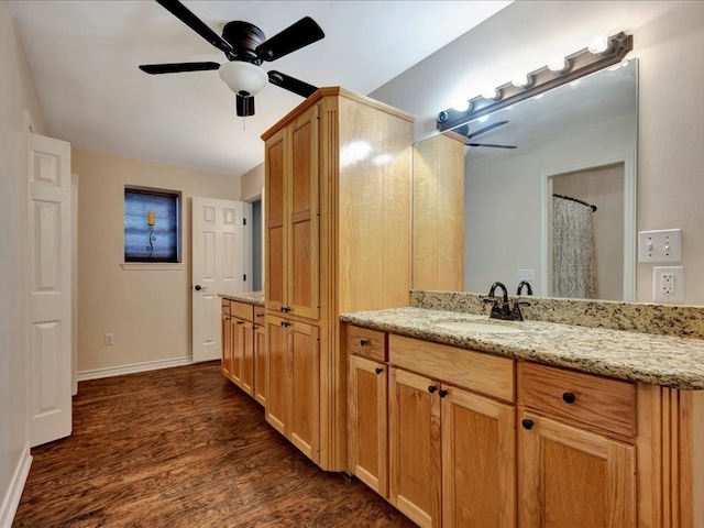 bathroom with ceiling fan, vanity, and wood-type flooring