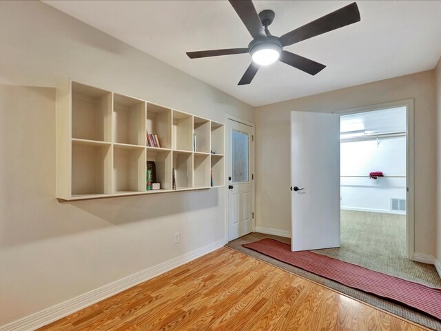 unfurnished bedroom featuring ceiling fan and light hardwood / wood-style flooring