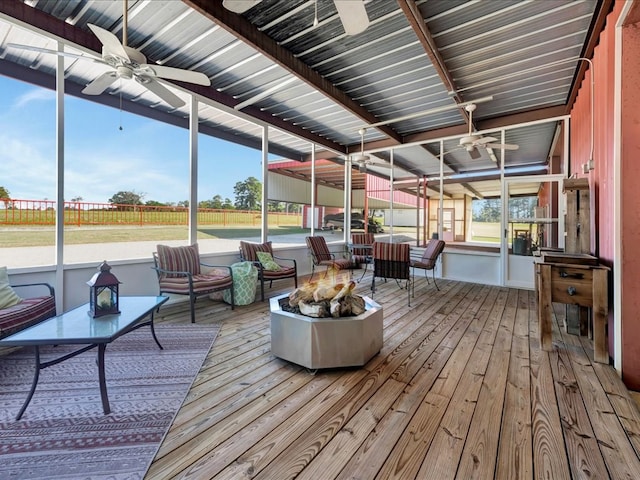 sunroom / solarium with ceiling fan