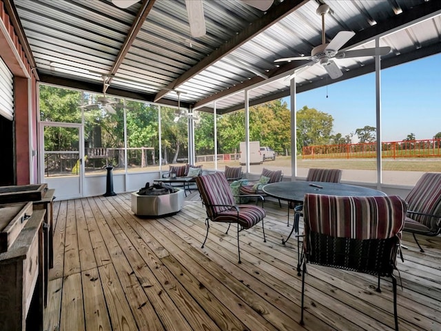 sunroom / solarium featuring ceiling fan and a wealth of natural light