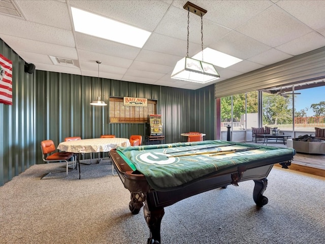 recreation room featuring carpet flooring, a paneled ceiling, and ceiling fan