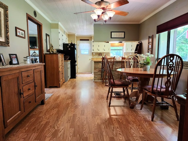 493 Hideaway Loop, Hemphill, TX 75948 - dining area with crown molding, light wood-style flooring, ceiling fan, and healthy amount of natural light