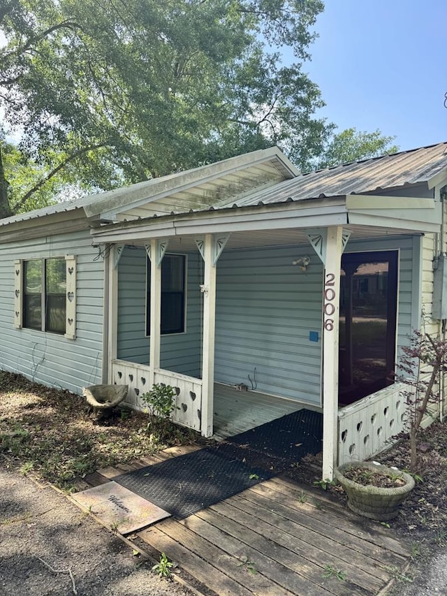 2006 Palmore Rd, Lufkin, TX 75904 - view of property exterior featuring metal roof and a porch