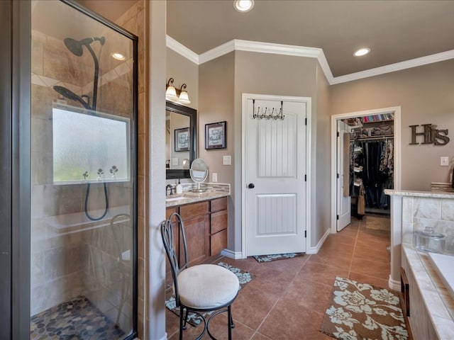 166 White Oak Ln, Lufkin, TX 75904 - bathroom with crown molding, a shower stall, a walk in closet, vanity, and tile patterned floors