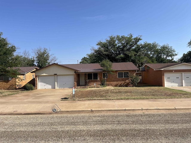 single story home with a garage