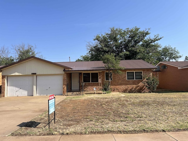 single story home featuring a garage