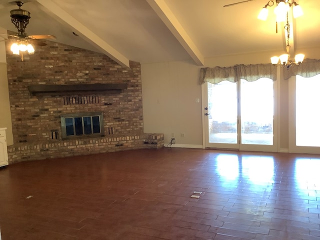 unfurnished living room featuring vaulted ceiling with beams, plenty of natural light, wood-type flooring, and ceiling fan with notable chandelier