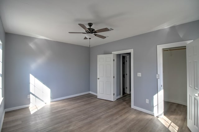 unfurnished bedroom featuring ceiling fan, a closet, and light hardwood / wood-style flooring