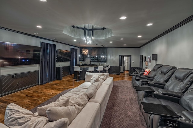 living room with crown molding, dark hardwood / wood-style floors, and a notable chandelier