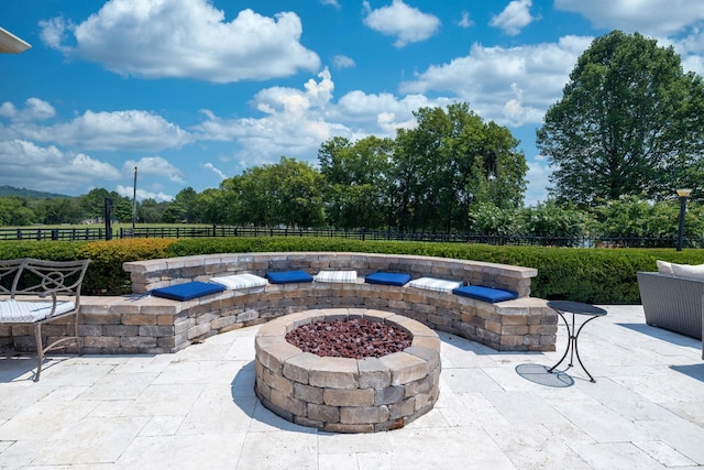 view of terrace featuring an outdoor fire pit