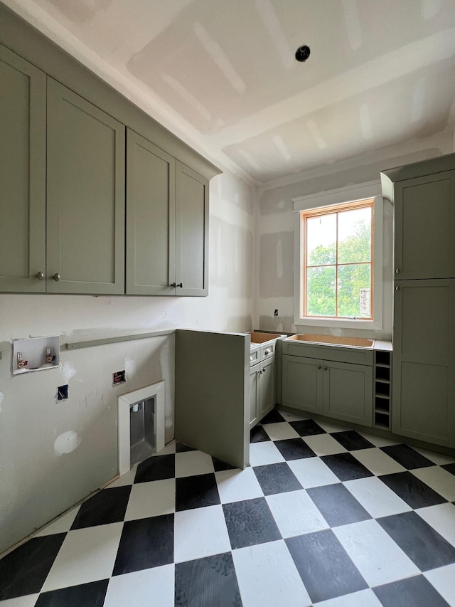 washroom featuring washer hookup and cabinets