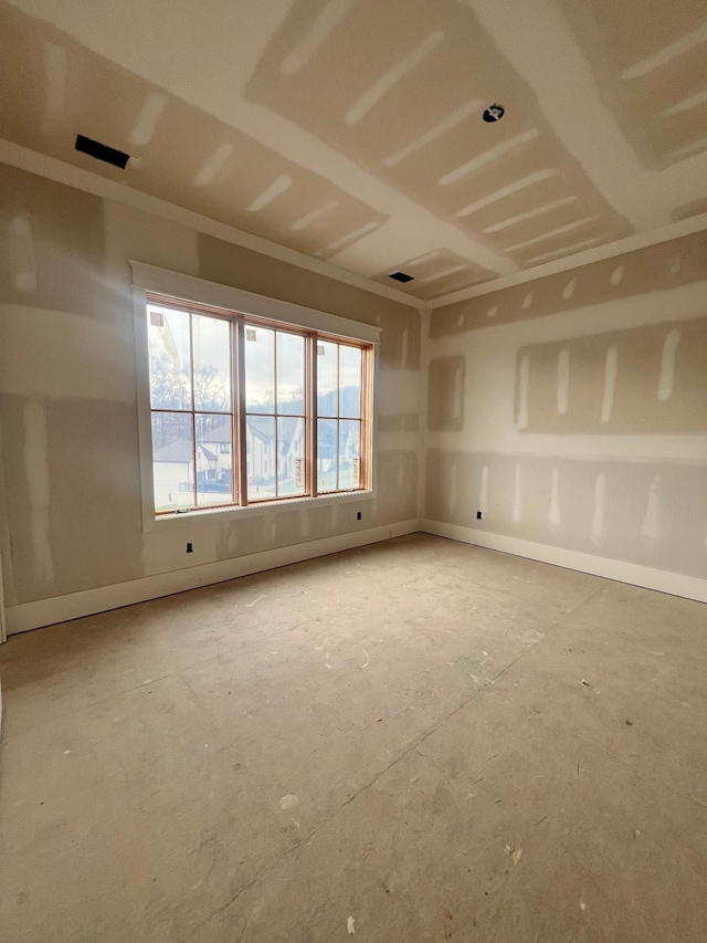 empty room with baseboards