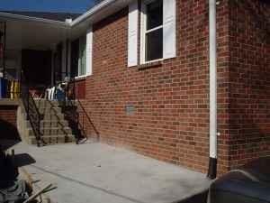 view of side of home with a patio