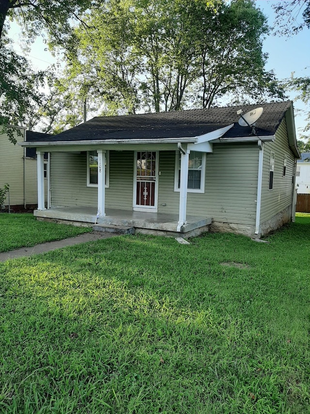 ranch-style house with a front lawn