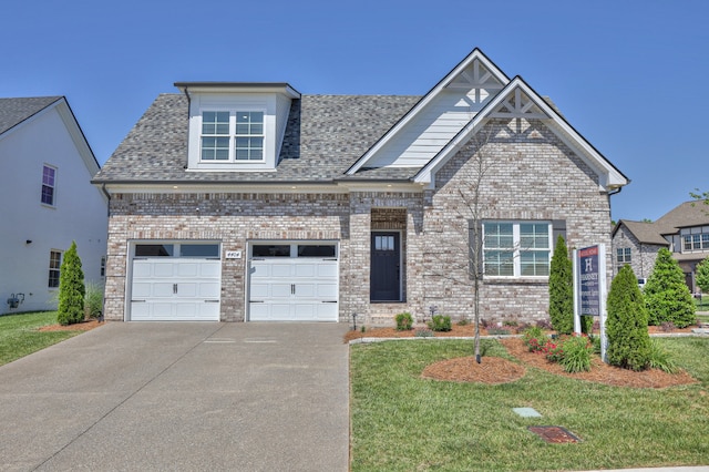 view of front facade featuring a garage and a front yard