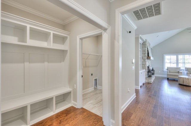 mudroom with hardwood / wood-style flooring and vaulted ceiling